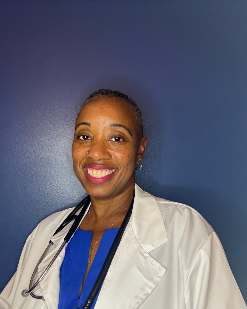 Nicole Griffin, DNP, NP-C, smiling in a white coat with a stethoscope around her neck